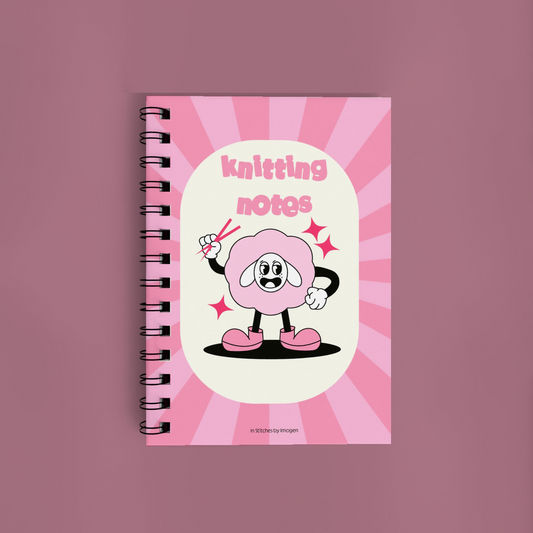 Notebook with a cartoon character and 'knitting notes' text on a pink background