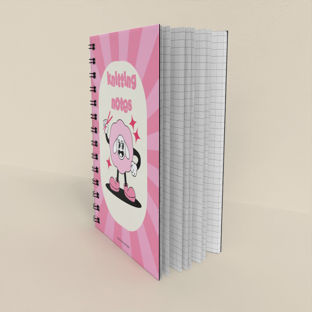 Notebook with pink cover and cartoon character on a beige background